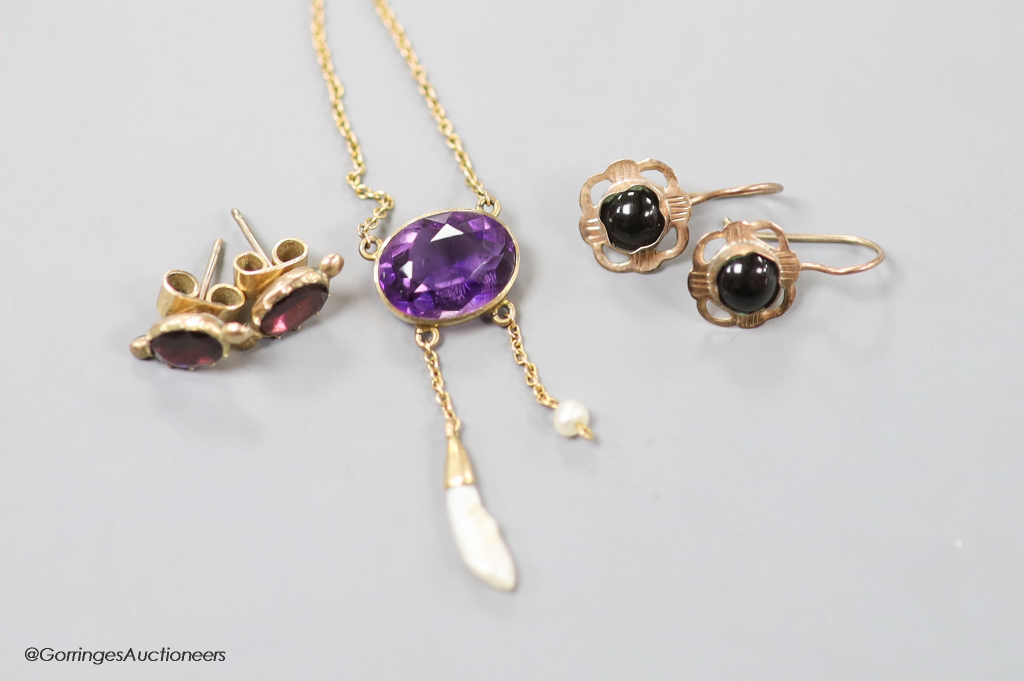 A 15ct amethyst and baroque pearl drop pendant (stone missing) and two pairs of yellow metal and gem set earrings